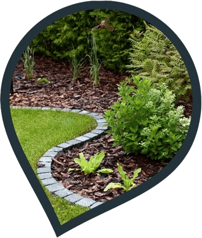 beautifully landscaped garden with pathway and decorative paving edges